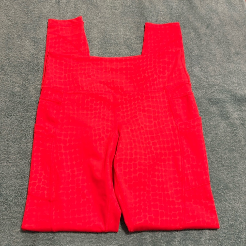 Washed, never worn Zyia active. Size 6-8. Red leggings with pockets!